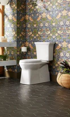 Two-piece elongated toilet with skirted trapway, 1.28 gpf