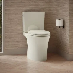 Two-piece elongated toilet with skirted trapway, 1.28 gpf