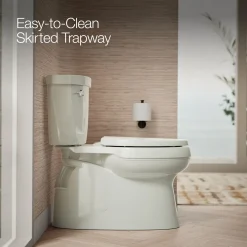 Two-piece elongated toilet with skirted trapway, 1.28 gpf