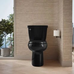 Two-piece elongated toilet with skirted trapway, 1.28 gpf