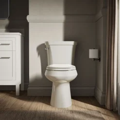 Two-piece elongated toilet with concealed trapway, 1.28 gpf