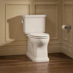 Two-piece elongated toilet with skirted trapway, 1.28 gpf