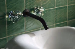 Wall-mount bathroom sink faucet handle trim