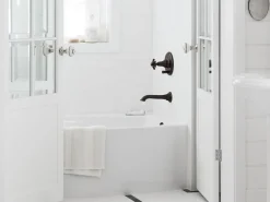 Wall-mount bath spout with flare design