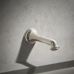 Wall-mount bath spout with turned design