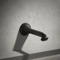 Wall-mount bath spout with turned design